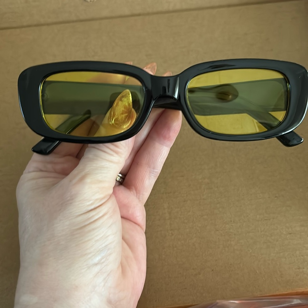 Black rectangular frames with yellow anti-glare lenses